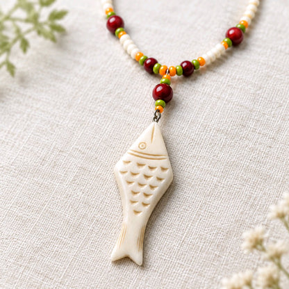 Carved fish necklace